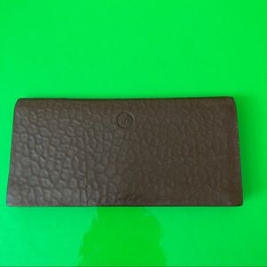 Bi-fold brown leather wallet